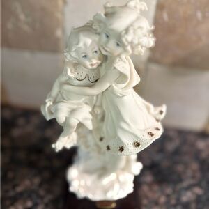 Elegant Porcelain Figurine of Two Children